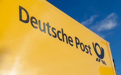 HANNOVER / GERMANY - NOVEMBER 27, 2016: german mail service ( Deutsche Post ) logo on a yellow container